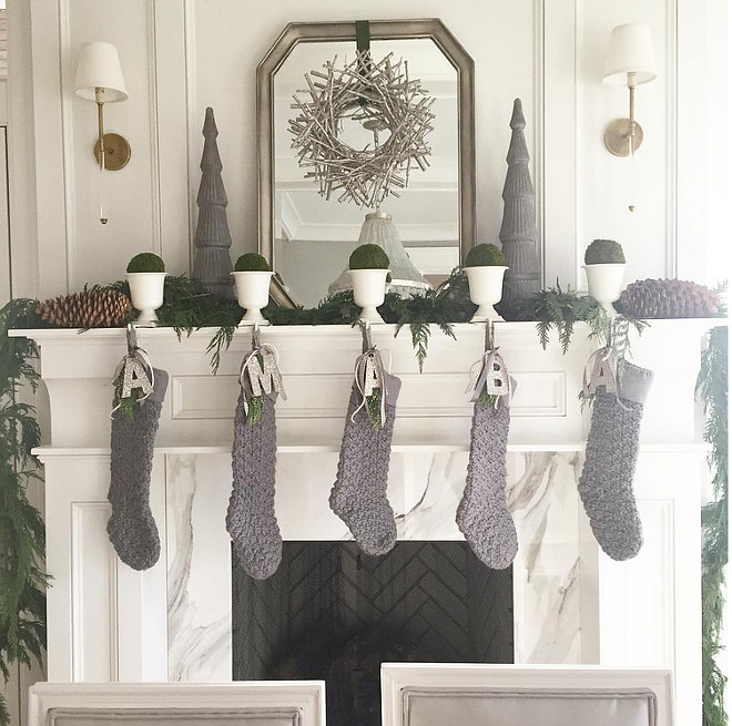 Gray and white Christmas. Gray and white Christmas Decor. Gray and white Christmas Decor Ideas. Gray and white Christmas Mantel Decor. Gray stocking are from Ballard Designs. Caitlin Creer Interiors.