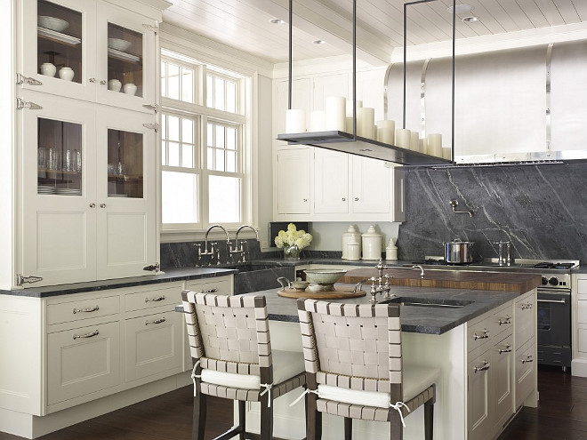 Ivory Kitchen Cabinets with Soapstone Countertop and Soapstone slab backsplash. Hickman Design Associates.