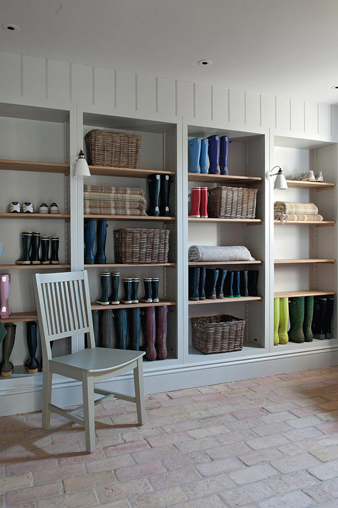 Mudroom with open cabinet shelves and brick flooring. #Mudroom Sims Hilditch.