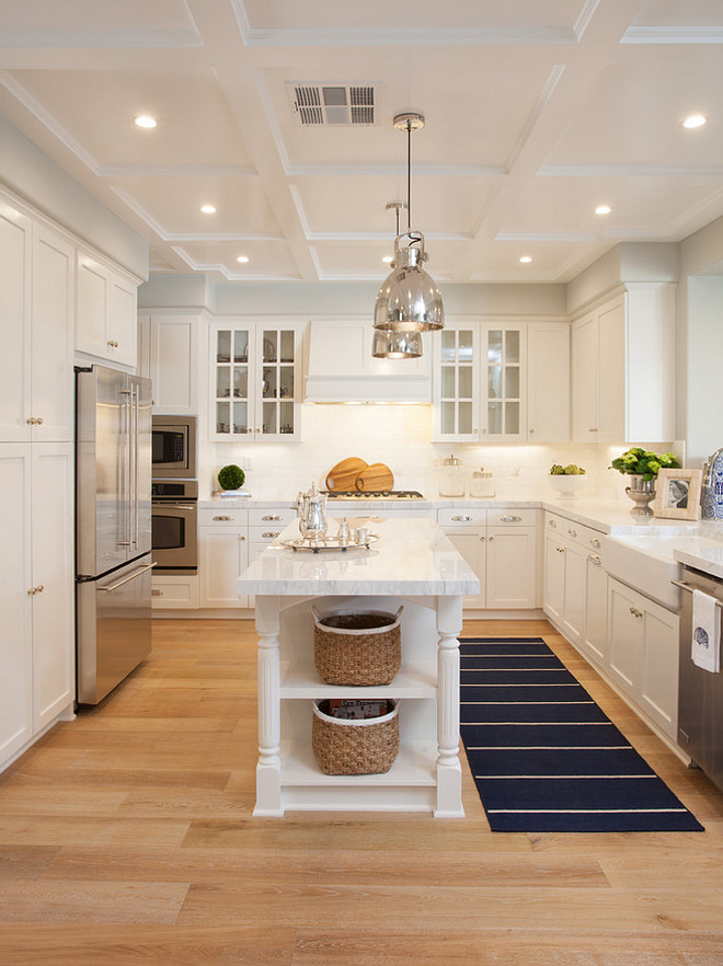 Narrow Kitchen Island. A pair of polished nickel industrial pendants hang over a narrow kitchen island with white quartzite countertop. #Narroe #KitchenIsland #NarrowIsland AGK Design Studio.