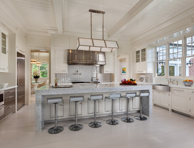 Waterfall Kitchen Island. Gorgeous kitchen with bleached hardwood floors, custom stainless steel hood and a waterfall kitchen island. #Waterfall #KitchenIsland Sotheby's Homes.