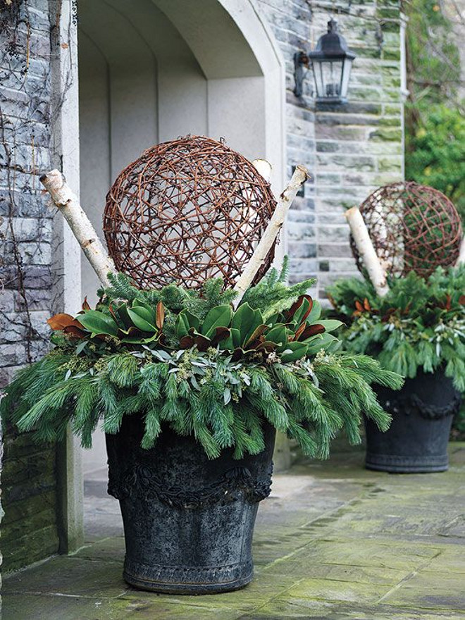 Winter Planter in front of garage. #Winter #planters #garage Via Canadian Gardening.