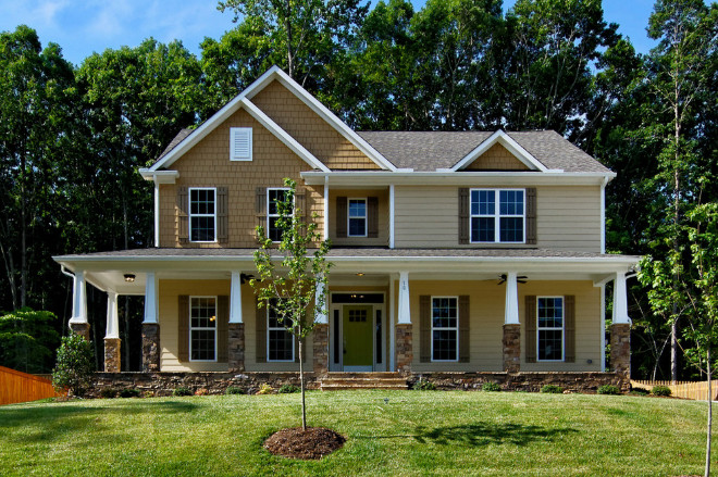 Craftsman home with wrap around Tapered porch columns. Craftsman home exterior with wrap around Tapered porch columns. #Craftsmanhome #Craftsmanhomeexterior #Craftsmanhomewraparoundporch #Craftsmanhomeporch #CraftsmanTaperedColumns #TaperedColumns Cimarron Homes.