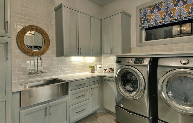 Gray Laundry Room Cabinet paint Color. Gray Laundry Room Cabinet with stainless steel farmhouse sink. Gray Laundry Room Cabinet Paint color ideas. #GrayLaundryRoom #Cabinet #PaintColor Geschke Group Architecture.