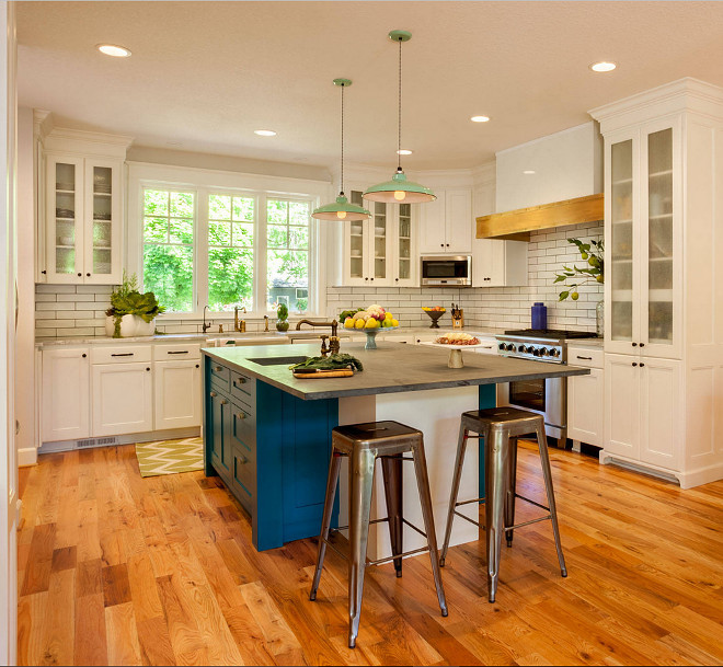 White Kitchen with Blue island paint color. White kitchen cabinet paint color is White Dove OC-17 Benjamin Moore. Blue island paint color is Benjamin Moore Naples Blue 2057-30. Garrison Hullinger Interior Design Inc.