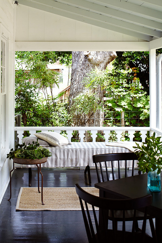 Farmhouse front porch. Farmhouse front porch painted floors. Farmhouse front porch painted floor ideas. Farmhouse front porch with painted floors and a daybed. #Farmhousefrontporch #paintedporchfloors #daybed #porchdaybed Tim Cuppett Architects.