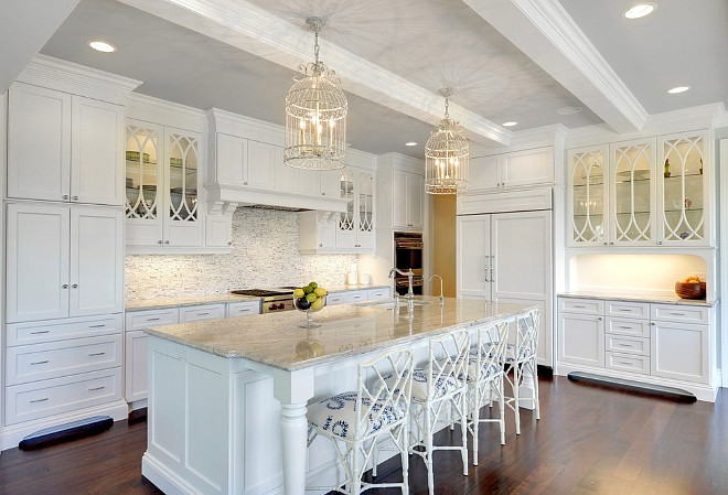 Crisp white kitchen. Large crisp white kitchen with faux bamboo counter stools from Ballard Designs. #Kitchen #Crispwhitekitchen #fauxbamboocounterstools Stonewood Inc.