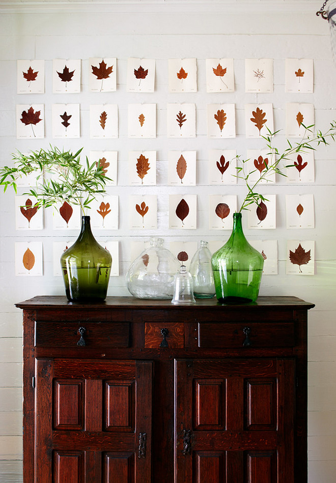 Farmhouse art decor. Farmhouse art. Dried leaves mounted on paper, tacked to wall above antique English hutch in farmhouse. Tim Cuppett Architects.