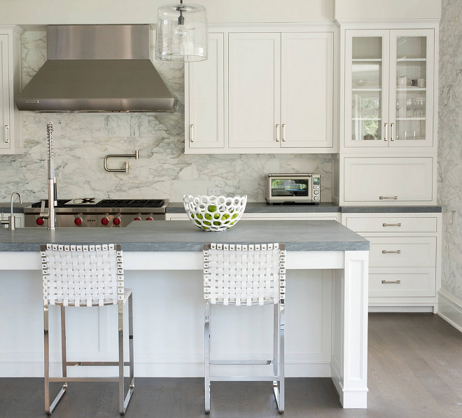 Kitchen with floor to ceiling marble tile backsplash. #Kitchen #floortoceilingtile #marbletilebacksplash Peter Cadoux Architects.