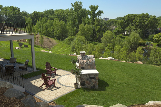 Outdoor Fireplace Backyard Layout. Patio and deck open to outdoor fireplace in this private backyard. #Backyard #OutdoorFireplace Spacecrafting Photography. Carl M. Hansen Companies.