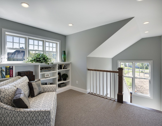 Staircase landing area with reading nook. Spacecrafting Photography. Carl M. Hansen Companies.