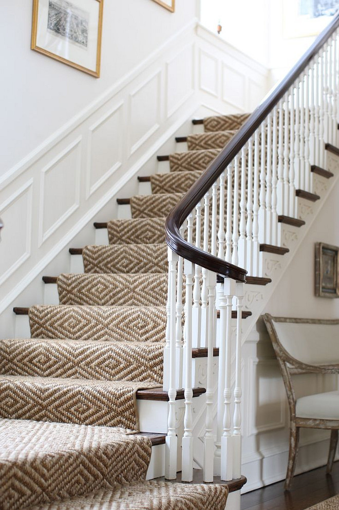 Staircase with sisal stair runnner, panel moulding and white walls. Staircase sisal stair runnner. #Staircase #sisal #stairrunnner J.K. Kling Design.