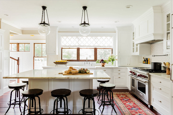 Warm White kitchen. Warm white with pops of color from kitchen rug and dark accents. Warm kitchen cabinet paint color. #WarmWhite #kitchen K.Marshall Design Inc.