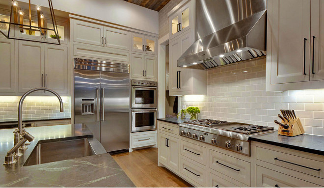 White cabinet kitchen with stainless steel appliances. Stainless steel appliances give an industrial feel to this kitchen. #kitchen #stainlessSteel Geschke Group Architecture.