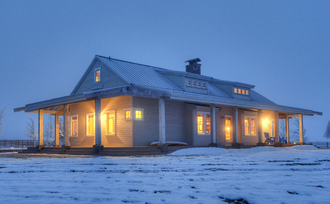 White farmhouse with gray metal roof. #whitefarmhouse #graymetalroof Designs Northwest Architects.