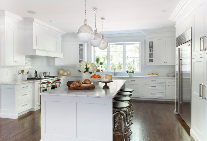 Kitchen with Restoration Hardware stools. Classic white Kitchen with Restoration Hardware stools. Beautiful white kitchen with Kitchen with Restoration Hardware stools and Hicks Pendants. #HicksPendants #kitchen #whitekitchen #RestorationHardwarestools Kathy Tracey Design LLC.