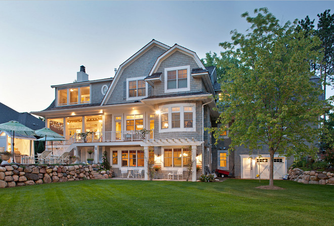 backyard beautiful pools cedar shake dutch colonial style Exterior four seasons porch gambrel roof garage luxury home tour patio seating specialty windows white trim Pillar Homes.