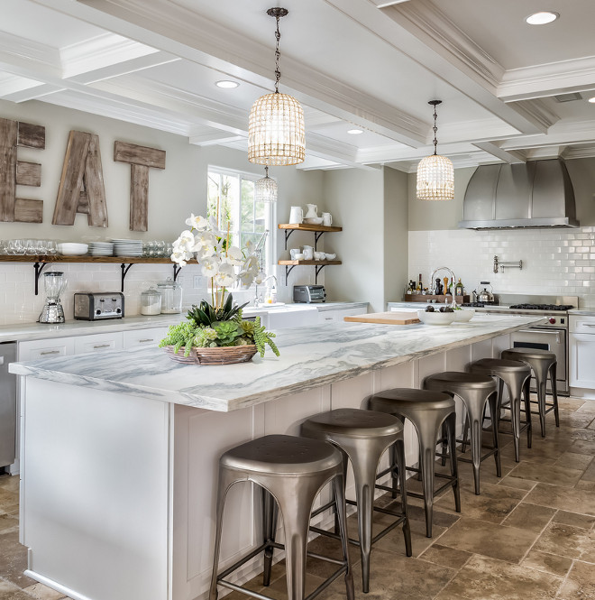 Kitchen features a long island with white and gray marble countertop. Kitchen with long island. #KitchenLongIsland #Longislandcountertop SoCal Property Portraits. 