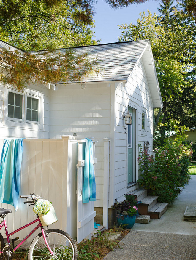 Small Cottage. White and turquoise small beach cottage. Small beach cottage with white exterior and turquoise front door. #Smallcottage #Smallbeachcottage #Whiteandturquoisecottage Erin O'Connor Design. Gridley + Graves Photographers