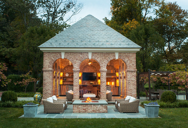 Pool House, Open Pool House, Nestled between the tennis court and swimming pool, this pool house accommodates a family’s desire for gracious outdoor entertaining, The symmetrical brick arcaded structure encloses a comfortable seating and dining area serviced by a professional grill and gas oven, The brick distributor was Mack Brick and it is Old Carolina Georgetown Modular brick #PoolHouse Douglas VanderHorn Architects