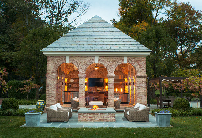 Pool House, Open Pool House, Nestled between the tennis court and swimming pool, this pool house accommodates a family’s desire for gracious outdoor entertaining, The symmetrical brick arcaded structure encloses a comfortable seating and dining area serviced by a professional grill and gas oven, The brick distributor was Mack Brick and it is Old Carolina Georgetown Modular brick #PoolHouse Douglas VanderHorn Architects