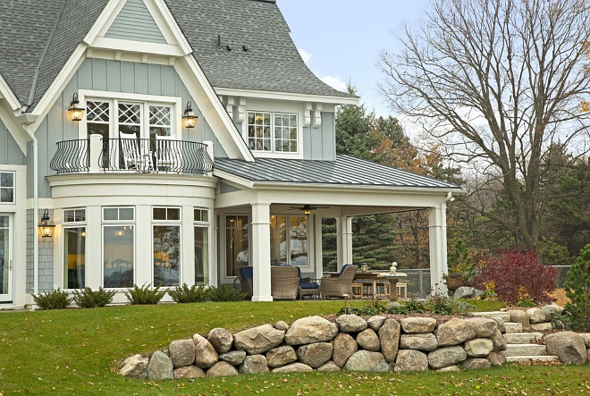 Back porch covered with metal roof #Backporch #Metalroof #lakehouse #roof #grayroof #grayhomexterior #coveredporch #porch #Porchroof Design by Stonewood, LLC