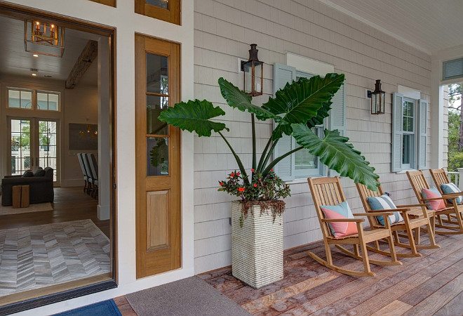 Beach house with blue shutters. Beach house front porch with blue shutters porch rocking chairs. #Beachhouse #Frontporch #Blueshutters #Porchchairs #Porchrockingchairs #Rockingchairs 30A Interiors