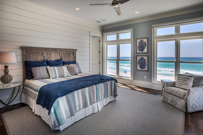 Coastal bedroom with shiplap accent wall. 30avibe Photography.