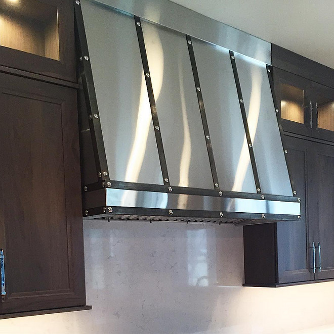 Custom Kitchen Hood. Custom stainless hood with kitchen with dark cabinets. #CustomHood #CustomStainlessHood #Kitchen #Kitchencabinets Cameo Homes Inc. Sita Montgomery Design