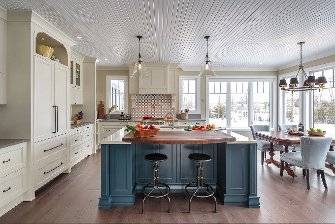 Farmhouse kitchen with blue island This elegant farmhouse kitchen includes a beautiful blue statement island #FarmhouseKitchen #blueisland #bluekitchenisland #Farmhousekitchenisland Astro Design Centre