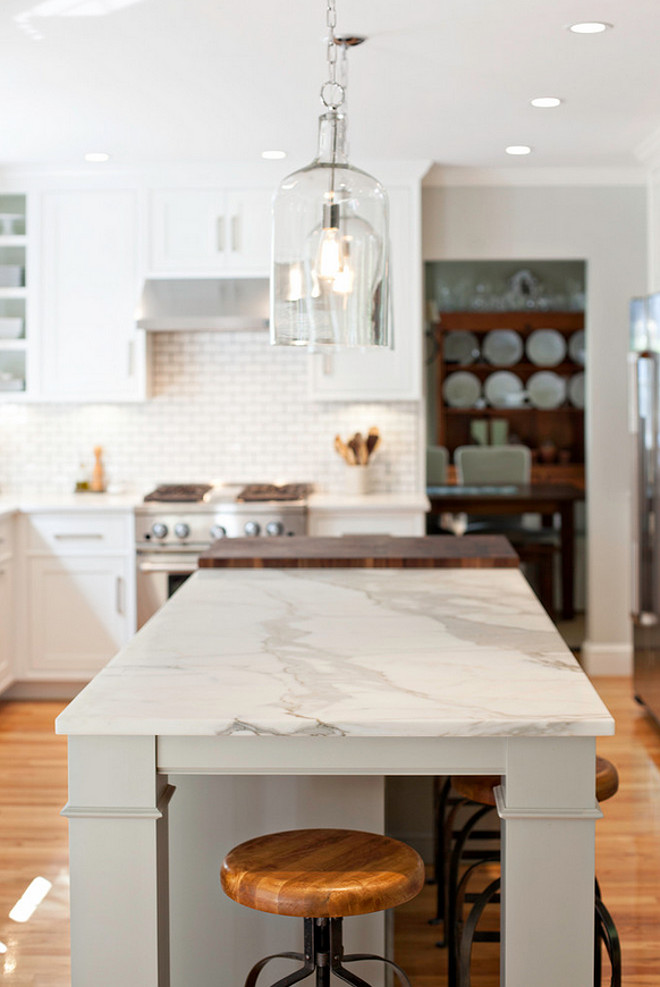 Honed Calacatta gold marble. The island countertop is honed Calacatta gold marble. #honedCalacattagoldmarble Pennville Custom Cabinetry