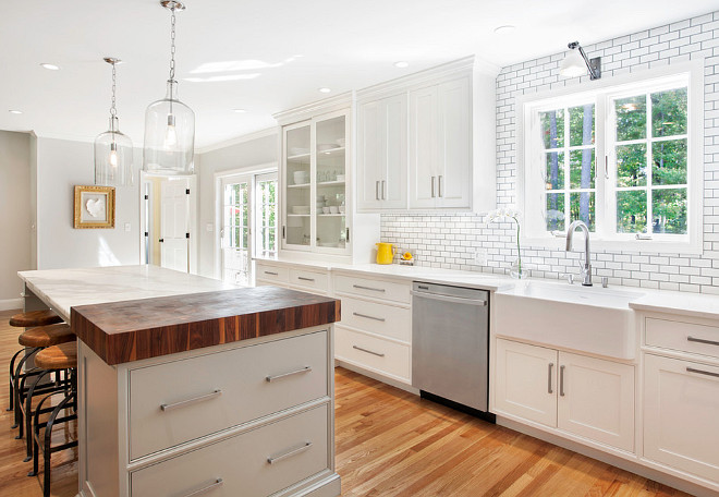 Modern farmhouse kitchen. This modern White farmhouse kitchen features a gray island and a farmhouse sink. #farmhousekitchen #grayisland #Farmhousesink Pennville Custom Cabinetry