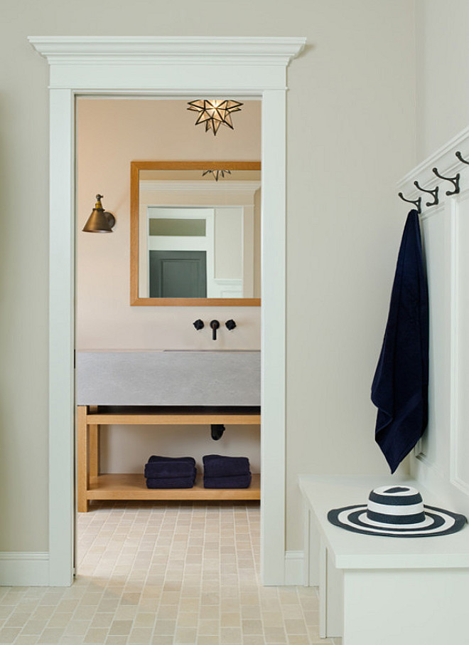 Basement Mudroom, Large family homes are now featuring not only one, but two mudrooms - the first is located in the main floor, and a second one is located in the basement. A basement mudroom can help keeping messy shoes in control and a low-maintenance flooring, like we see in the picture above, is a must. The flooring is called "Blend Crème Tumbled" and it was laid in a brick pattern. The grout is ivory. #Mudroom #basementMudroom #basementMudroom #tileflooring