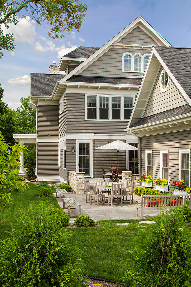 Small backyard divided by a small stone patio and grass area with easy to maintain landscaping. #Backyard #SmallBackyard #BackyardPatio #StonePatio #Easytomaintainlandscaping Spacecrafting Photography.