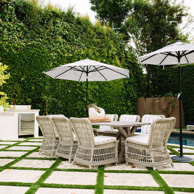 Trestle outdoor Table, Trestle outdoor dining table lined with wicker dining chairs #Trestleoutdoortable #Trestletable #outdoortable #wickerchairs Waterleaf Interiors