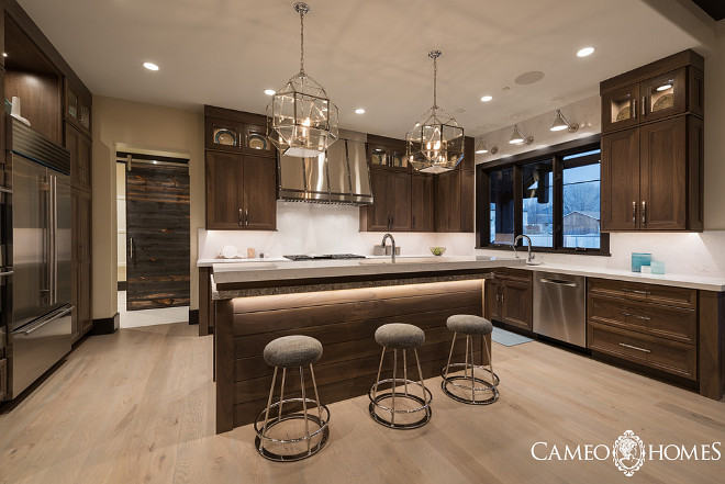 Walnut kitchen with Morris Pendants from Circa Lighting and quartz countertop. #MorrisPendants #Walnutkitchen #quartz Cameo Homes Inc.