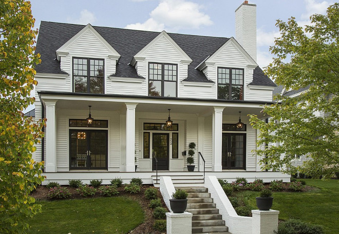 White house with black accents, gutters painted in black to match the black windows. White siding is Hardie Artisan 4" lap siding - with the Artisan siding you can mitre the outside corners. #Whitehouse #Whitehome #Whitehomepaintcolor #whitehouseblackwindows Spacecrafting Photography. Charlie & Co. Design, Ltd. Kroiss Development, Inc. 