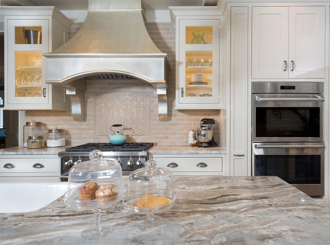 Faux painted kitchen hood. This kitchen hood was a custom piece by Benchmark Wood Studio and then faux painted out of silver leaf by the talented Faux Real LLC. Faux painted kitchen hood ideas. #Fauxpainted #kitchenhood Mike Schaap Builders