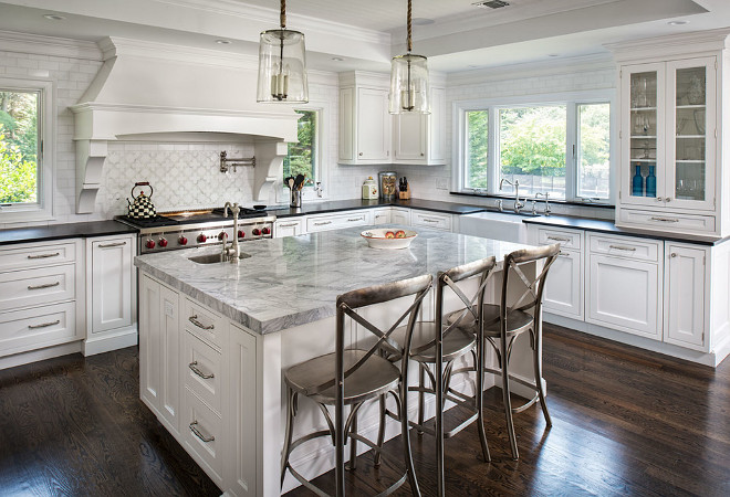 Kitchen island and perimeter countertop ideas. How to choose the right combination of island and perimeter countertop. The island countertop is a Super White Quartzite and the perimeter is a Black Absolute granite with a leathered finish. #KitchenCountertop #Kitchenislandperimetercountertop #Kitchenislandperimetercountertopideas #Kitchenislandperimetercountertopcombination Artista Kitchen & Bath Design