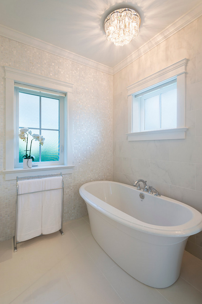 Bathroom Wall Tiles. Bathroom Wall Tile Combination. This bathroom combines less expensive ceramic tiles with beautiful Mother of Pearl 1" x 1" Shell White Tiles. #Bathroom #wallTiles #BathroomwallTiles #Bathroomtilecombination #bathroomtiling #MotherofPearlTiles Kemp Construction. Sarah Gallop Design Inc.