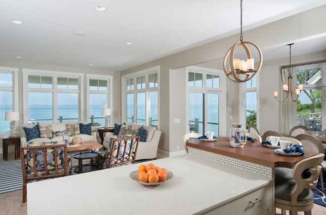 An impressive kitchen with stunning Ann Sachs tile backsplash, quartz countertops, richly stained bistro table and Viking Appliances overlook the generous, but clearly defined, living and dining rooms.