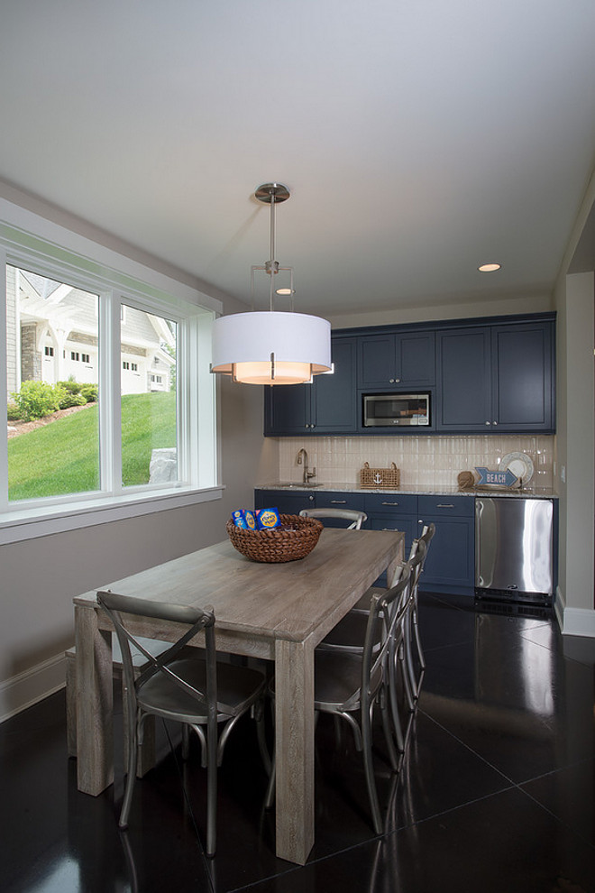 Basement Kitchen. Small basement kitchen with navy cabinets and stained and sealed concrete floors. #concretefloors #basement #Kitchen #basementkitchen