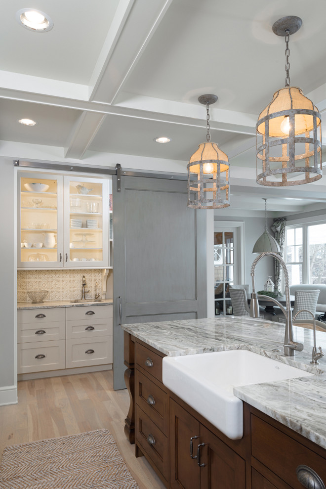 Kitchen Barn Door. Kitchen Barn Door Ideas. The Kitchen's Barn Door brings a modern rustic feel to this kitchen. #Kitchen #BarnDoor #KitchenBarnDoor Mike Schaap Builders