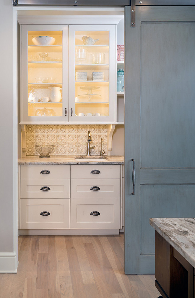 Kitchen bar with barn door. The kitchen bar can be concealed with a gray barn door. #Kitchenbar #barndoor #Kitchen #barbarndoor #Graybarndoor Mike Schaap Builders