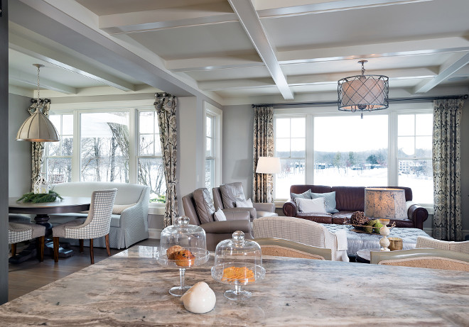 Kitchen opens to breakfast room with a settee and family room with coffered ceilings. #Openlayout #openkitchen #breakfastroom #cofferedceiling #livingroom Mike Schaap Builders