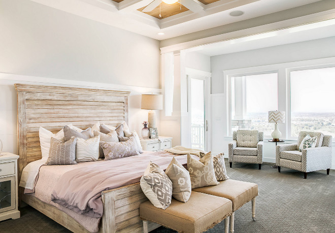 Master Bedroom. Bedroom. Bedroom features coffered ceiling, gray carpet, patterned armchairs, seating area, tray ceiling, white trim, whitewashed wooden bed and wood ceiling. #Bedroom #Masterbedroom DWL Photography