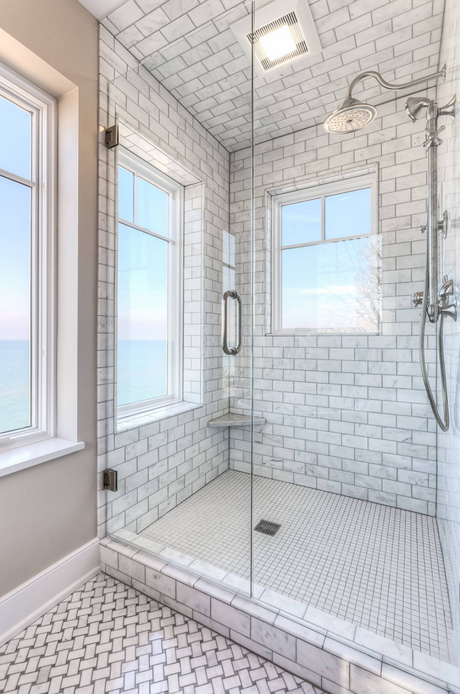 Shower tiling. Floor to ceiling shower tile. The shower features floor-to-ceiling Carrara marble tile. Shower with floor to ceiling tiles. Shower with floor to ceiling tiling. Shower with floor to ceiling subway tile. Mike Schaap Builders