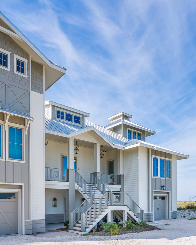 White and gray exterior paint color: White and gray exterior paint color: Siding: Sherwin Williams Dover White. Board and batten Sherwin Williams Intellectual Gray. Trim Sherwin Williams Natural Choice. Dalrymple Sallis Architecture