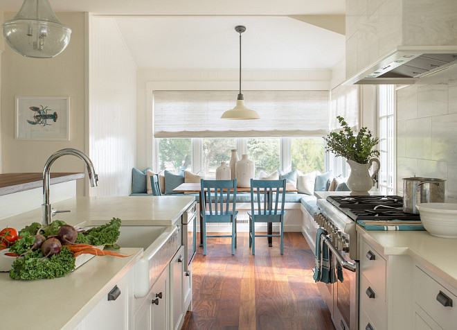 Creamy white kitchen. Creamy white kitchen features neutral off white wall paint color, hardwood floors and creamy white countertops. #Creamywhitekitchen #Offwhitekitchen #whitekitchen #NeutralKitchen Martha's Vineyard Interior Design