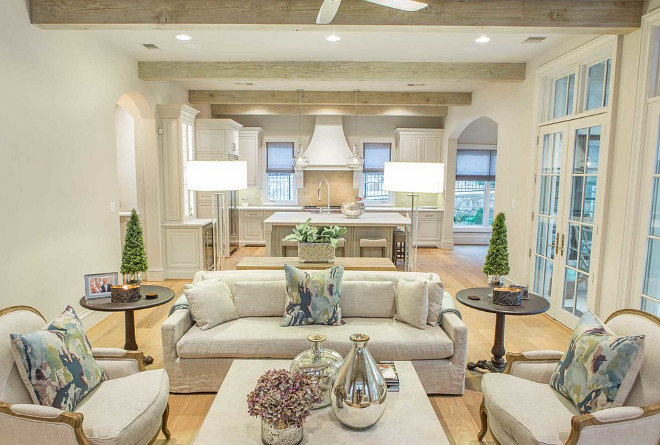 French Kitchen opens to French family room with ceiling beams. French Interiors. French Ceiling Beams. French Homes. #Frenchkitchen #FrenchFamilyRoom #FrenchInteriors #Frenchceilingbeams #ceilingbeams #FrenchHomes Platinum Series by Mark Molthan